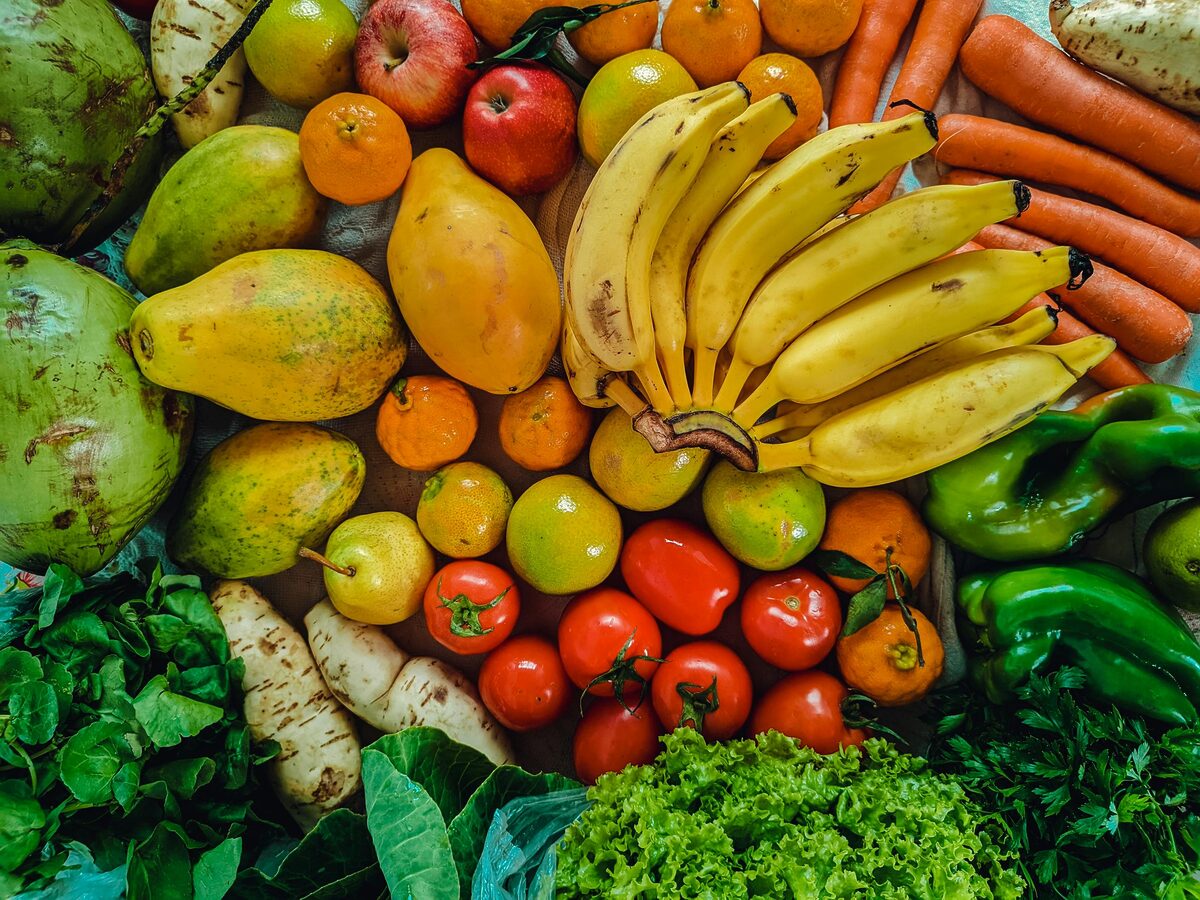 Colorful assortment of fruits and vegetables at a market in São Paulo, Brazil.